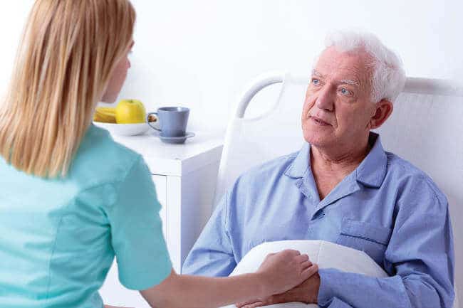 female caregiver with older man