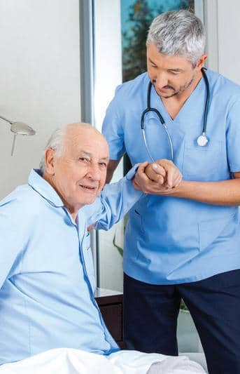 Male home health aide with elderly man